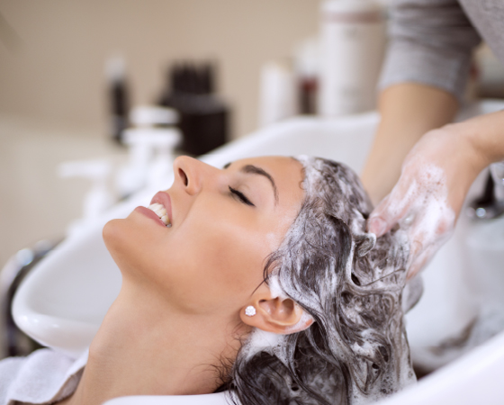 a lady's hair being washed