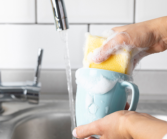 hand washing a cup